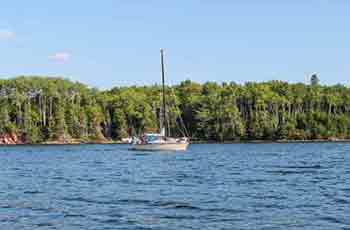 sail boat and fly fishing in the Bras d’Or Lake and River Denys on Cape Breton Island, Nova Scotia, Canada